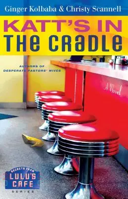 Katt's in the Cradle: Un roman cu secrete din Lulu's Cafe - Katt's in the Cradle: A Secrets from Lulu's Cafe Novel